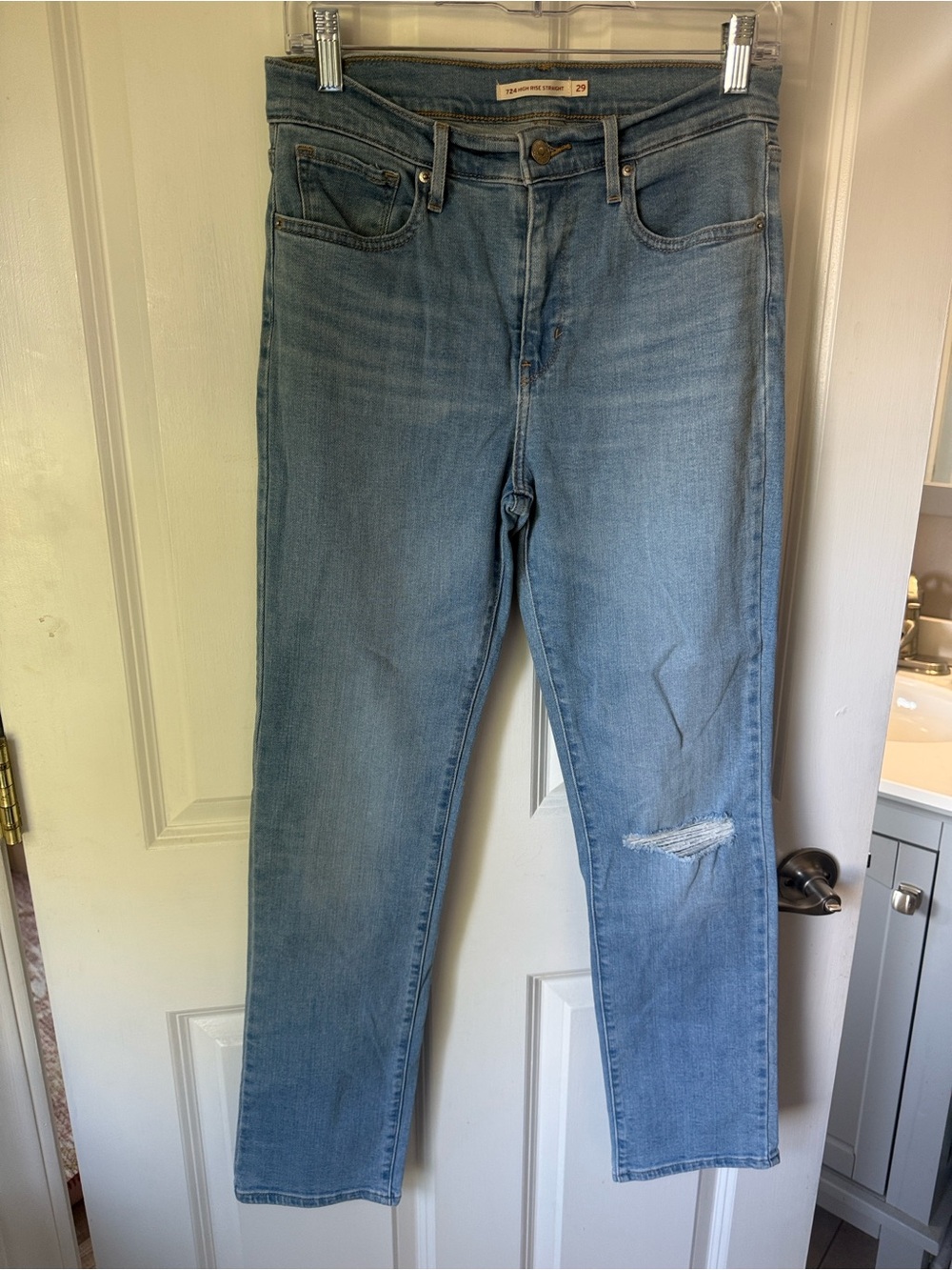 Levi's High-Rise Light Blue Denim Jeans with Knee Distress